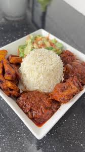 White Rice and stew, salad, plantain, and Turkey